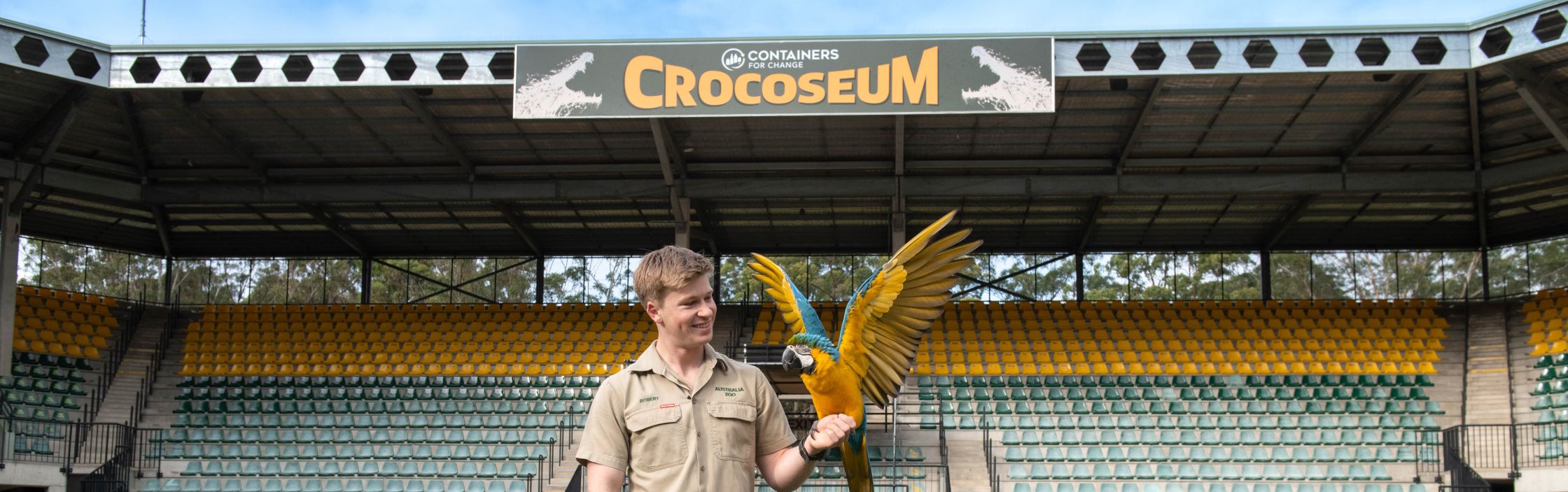 Robert with a maccaw in the Containers for Change Crocoseum